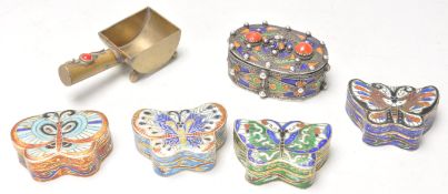 A collection of 20th Century enamelled pill / trinket boxes to include four boxes in the form of