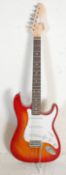 A vintage Irin electric Fender strat style guitar having a cherry burst body with a white scratch