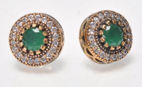 A pair of ladies dress stud earrings of Renaissance style set with round cut green stones and CZ'