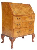 An early 20th Century 1930' Art Deco walnut fall front writing desk bureau having a panelled full