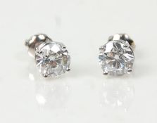 A pair of platinum and diamond stud earrings set with brilliant cut diamonds. Studs marked 950