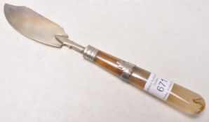 An early 19th Century Scottish Georgian silver fish knife having a polished stone handle with leaf