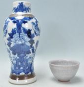 A 19th Century Chinese crackle glaze blue and white baluster vase having hand painted peony