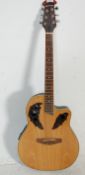 A 20th Century gear4music electric acoustic six string guitar having a domed back with dark wood