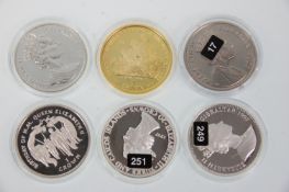 A group of six silver coins (one gold plated example) to include 1997 20 Crowns 'Lady Of The