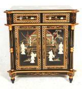 A 20th Century Chinese sideboard cupboard having two drawers above twin door cupboards, having