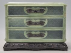 A vintage early 20th Century Art Deco 1930's Chinese Bakelite jewellery box in the form of a chest