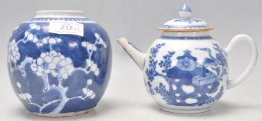 A 19th Century Chinese blue and white tea pot decorated with hand painted precious objects
