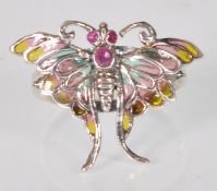 A stamped 925 silver ring having a split shank with a butterfly to the head having plique a jour