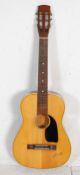 A vintage six string German made 'Florida' half size acoustic guitar having inlaid fretboard and