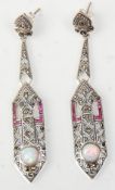 A pair of stamped 925 silver Art Deco style drop earrings being set with marcasites and red stones