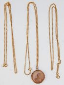 A 19th Century Victorian 9ct gold photograph pendant set with a round glass panel housing a