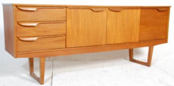 A 1960's retro vintage teak wood sideboard in the manner of McIntosh having the central twin door