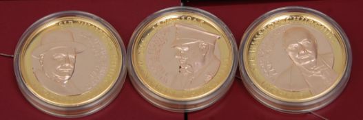A good group of three Sir Winston Churchill Commemorative £2 coins with each one layered in 18ct