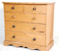 A 19th Century Victorian pine chest of drawers having two over three drawers with dark wood turned