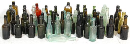 A collection of 19th Century and early 20th century glass advertising bottles to include Laing & Co,