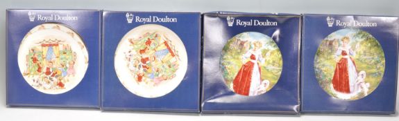 A group of Royal Doulton boxed ceramic cabinet plates to include 2x Bunnykins Help Santa PN157 and