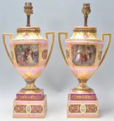 A pair of 19th Century Royal Vienna urn vase lamps having square twin handles and raised on