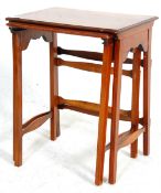 An Edwardian mahogany inlaid nest of two tables of small proportions having rectangular table tops
