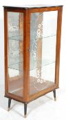 An 20th Century Art Deco walnut veneer display china cabinet having a glazed single door flanked