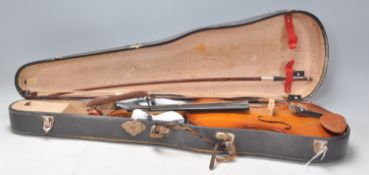 A 20th Century full size violin with two piece back and two bows. Paper label for Parrot to inner.