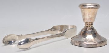 A pair of 19th Century silver hallmarked sugar tongs (hallmarked 1833, makers marks GT) together