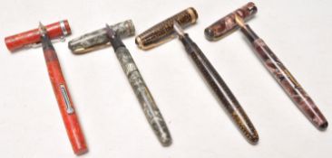 A group of four vintage early 20th Century vintage writing pens to include a Onoto pen being