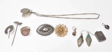 A collection of antique silver jewellery to include a Victorian horseshoe stickpin, a Victorian
