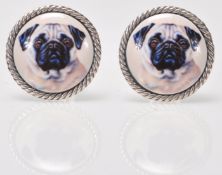 A pair of gentleman's silver cufflinks having round heads set with enamelled panels decorated with