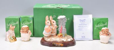 A group of four Beswick Beatrix Potter porcelain figures to include Gold Stamp Hunca Munca Sweeping,