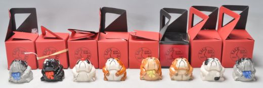 A group of eight Kevin Francis face pots each in the form of a different British Bulldog.