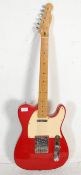 A Squier six string telecaster by Fender series electric guitar having a red painted body with white