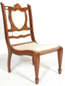 A 19th century VIctorian mahogany inlaid nursing chair. The chair raised on square tapering legs