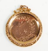 A lovely Victorian 9ct gold back and front round locket having engraved swallow and floral