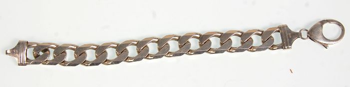 A thick and heavy silver flat link chain gentlemens bracelet having a lobster clasp. Total weight
