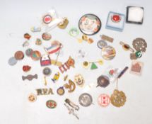 A collection of vintage enamelled and other badges to include military, sporting and advertising.