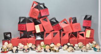 A group of twenty-four Kevin Francis ceramic face pots in the form of celebrity characters to