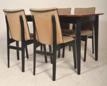 A good mid century teak wood extending dining tabl