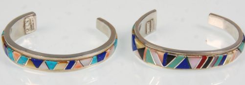 Two handmade sterling silver bangle bracelets having applied semi precious stone decoration. Both