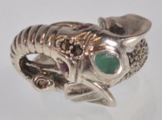 A stamped 925 silver ring in the form of  an elephant set with red and green stones, and marcasites.