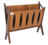 A retro mid century walnut magazine rack  stand. The x-frame supports with returns supporting a