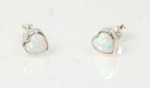 A pair of ladies 20th Century silver stud earrings set with heart cut opals. Weight 1.1g. Measures