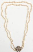 An lovely vintage 20th Century pearl necklace having two rows of graduating pearls on a silver