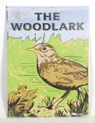 A large enamelled pub sign for ' The Woodlark ' having a graphic bird and chicks design. 113 cm x 82