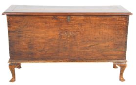 A 19th Century mahogany chest of rectangular form being raised on cabriole feet with ebonised