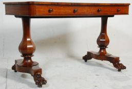 An early 19th Century rosewood writing table / desk having a rectangular top with twin drawers