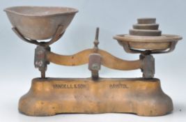 A pair of 19th Century Victorian local Bristol interest balance shop scales having a gilt base