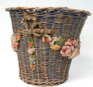A 20th Century antique woven wicker basket of tapering cylindrical form having painted barbola
