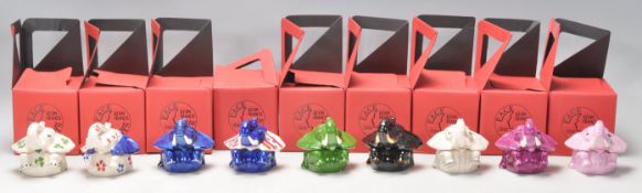A collection of nine elephant ceramic Kevin Francis face pots to include Nellie in various coloured,