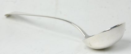 A large 19th Century George IV silver hallmarked ladle having an engraved lion and axe cress to